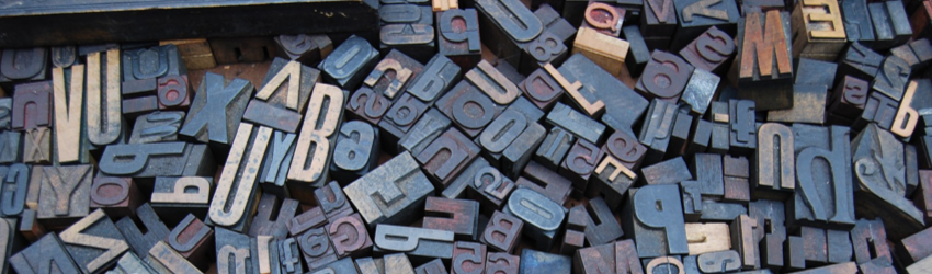 Header image of jumbled wood letters in various fonts